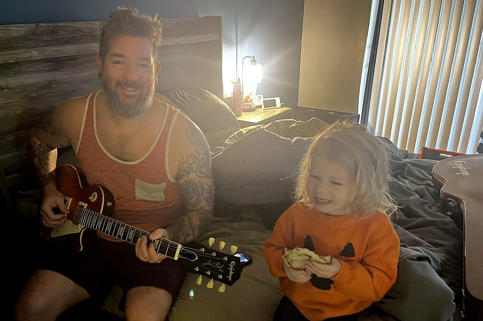 Rad Dad Lyfe author Joe Pye playing guitar with daughter Radley